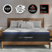 Helix Midnight mattress on a bed with various awards displayed above, in a bedroom setting.